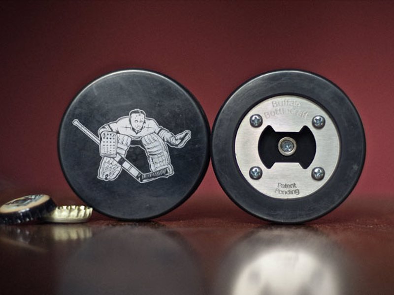 Real Hockey Puck Bottle Opener - A bottle opener made from a real hockey puck, magnetic to catch bottle caps