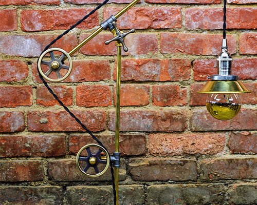 Industrial Pulley Table Lamp - Unique Steampunk/ Industrial lamp. Featuring 3 pulleys, with two-tone color feature of solid brass and antique nickel finish. 