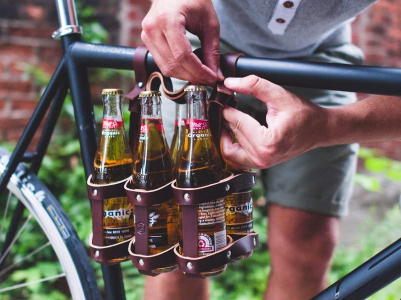 Leather Bicycle Six Pack Caddy - No need for bags or dangerous hand-carrying of your beers, with this handy six-pack bicycle beer caddy